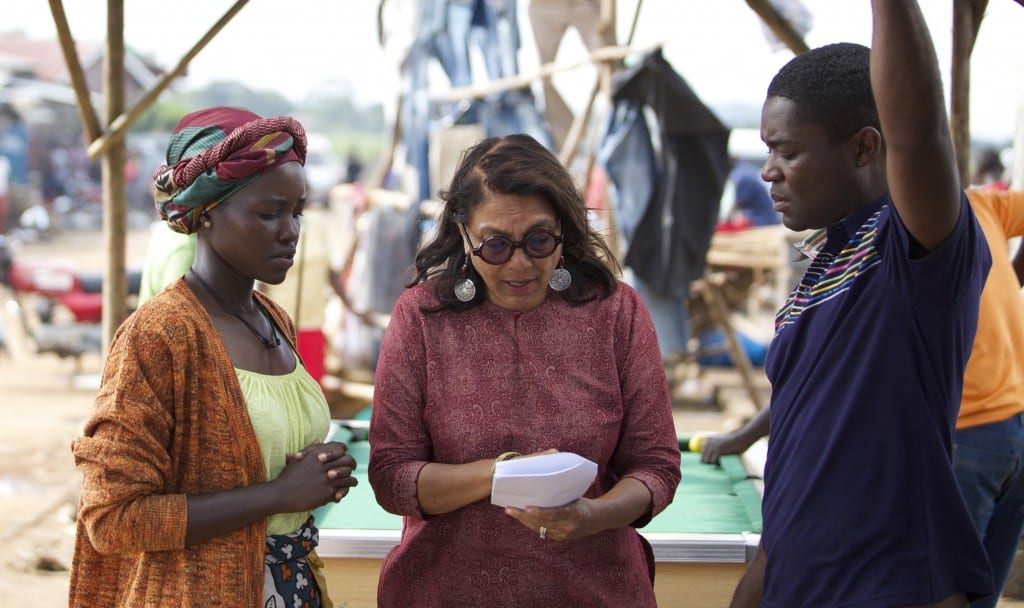 Director Mira Nair on the set of Disney's QUEEN OF KATWE iwith David Oyelowo and Lupita Nyong'o. The vibrant true story of a young girl from the streets of rural Uganda whose world changes when she is introduced to the game of chess, the film also stars newcomer Madina Nalwanga.