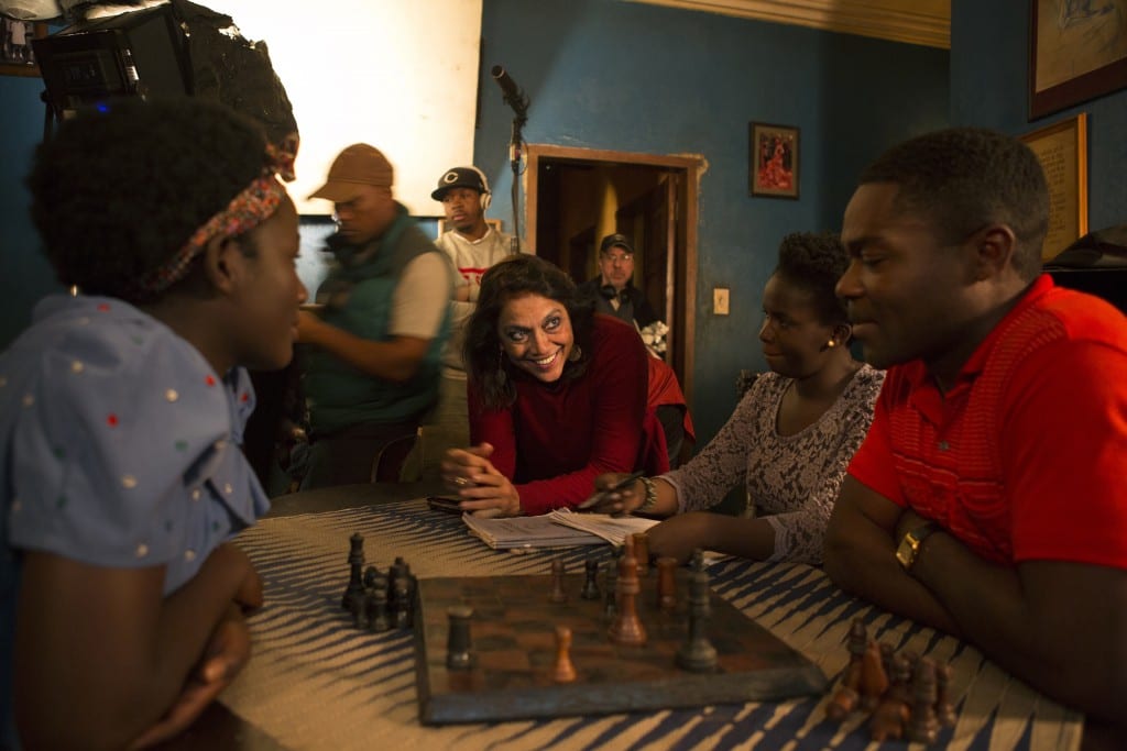 Director Mira Nair on the set of Disney's QUEEN OF KATWE iwith David Oyelowo,Madina Nalwanga and Esther Lutaaya. The vibrant true story of a young girl from the streets of rural Uganda whose world changes when she is introduced to the game of chess, the film also stars Oscar (TM) winner Lupita Nyong'o.