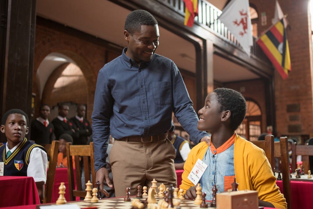 David Oyelowo is Robert Katende and Madina Nalwanga is Phiona Mutesi in in Disney's QUEEN OF KATWE, based on a true story of a young girl from the streets of rural Uganda whose world rapidly changes when she is introduced to the game of chess. Oscar (TM) winner Lupita Nyong'o also stars in the film, directed by Mira Nair.