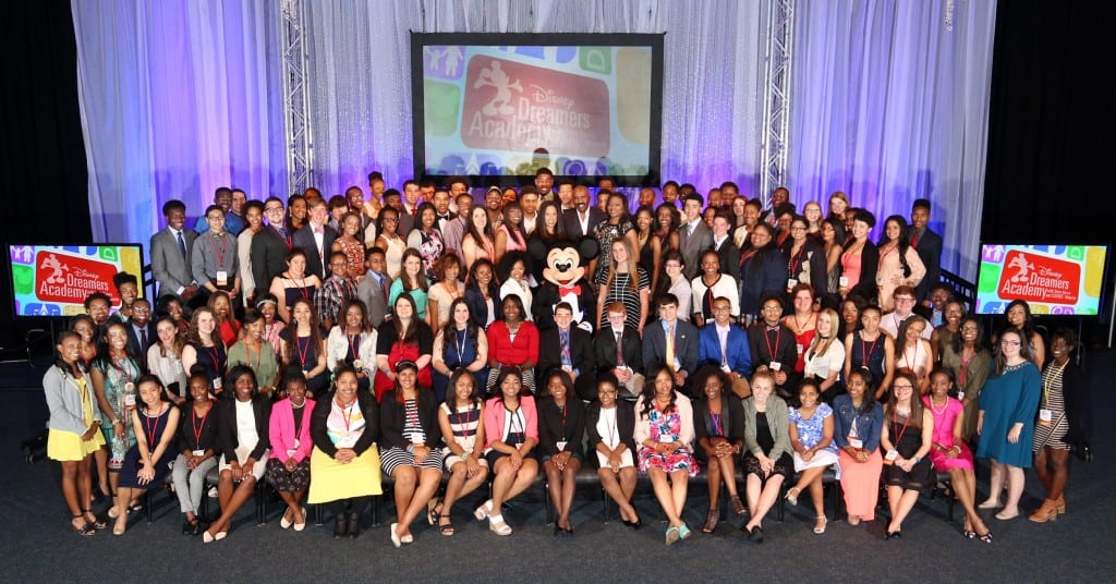 Disney Dreamers join (behind Mickey Mouse L-R) Mikki Taylor, editor-at-large for Essence Magazine, Michelle Ebanks, president of Essence Communications, Inc., radio and TV personality Steve Harvey, Tracey D. Powell, executive champion of Disney Dreamers Academy, and Mickey Mouse on March 6, 2016 to celebrate the commencement of the ninth Disney Dreamers Academy with Steve Harvey and Essence Magazine at Walt Disney World Resort in Lake Buena Vista, Fla. The annual event is a career-inspiration program for distinguished high school students from across the U.S. (Gregg Newton, photographer)