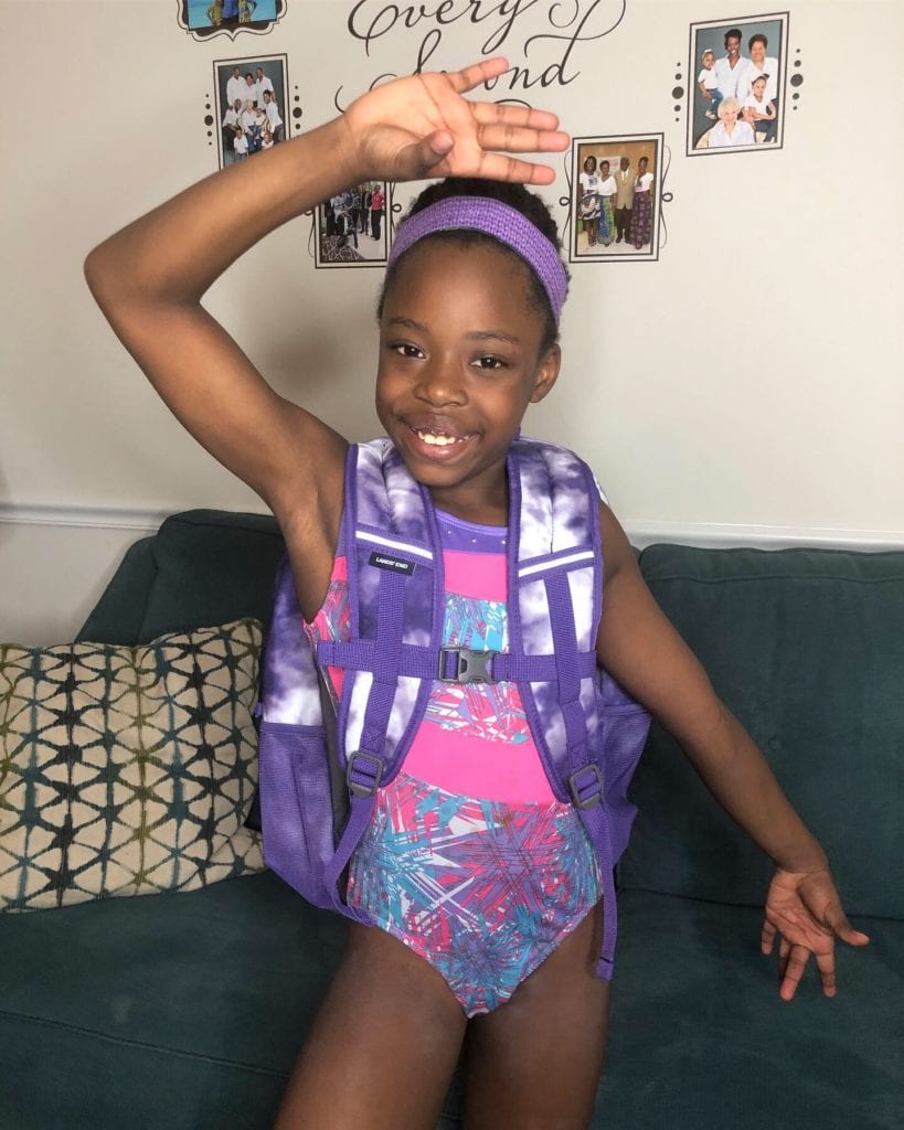 gymnast Brielle shows off her new backpack